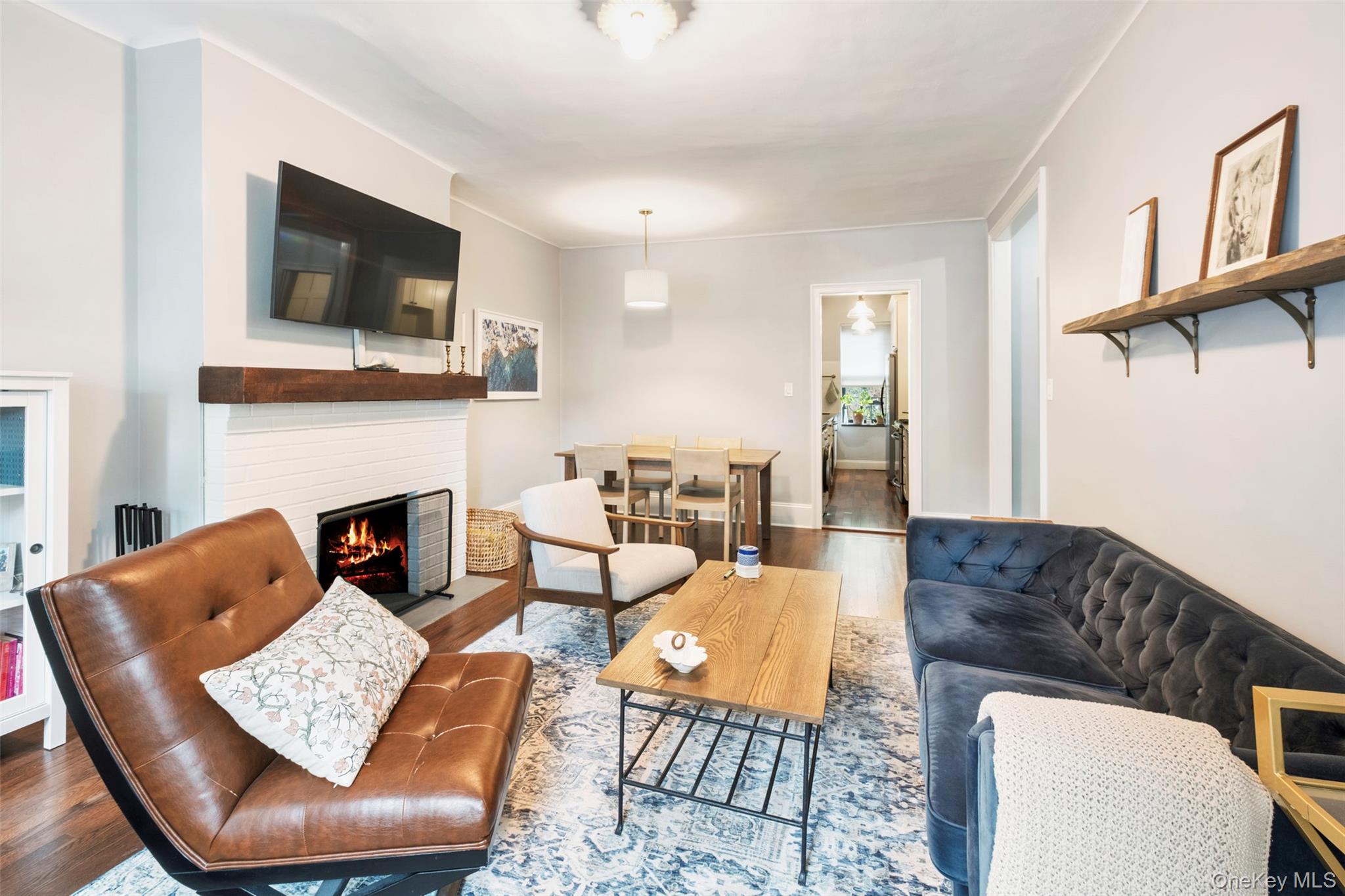 244 Bronxville Road, Unit G3 Bronxville, NY 10708 - Photo 6 of 18 a living room with furniture fireplace and flat screen tv