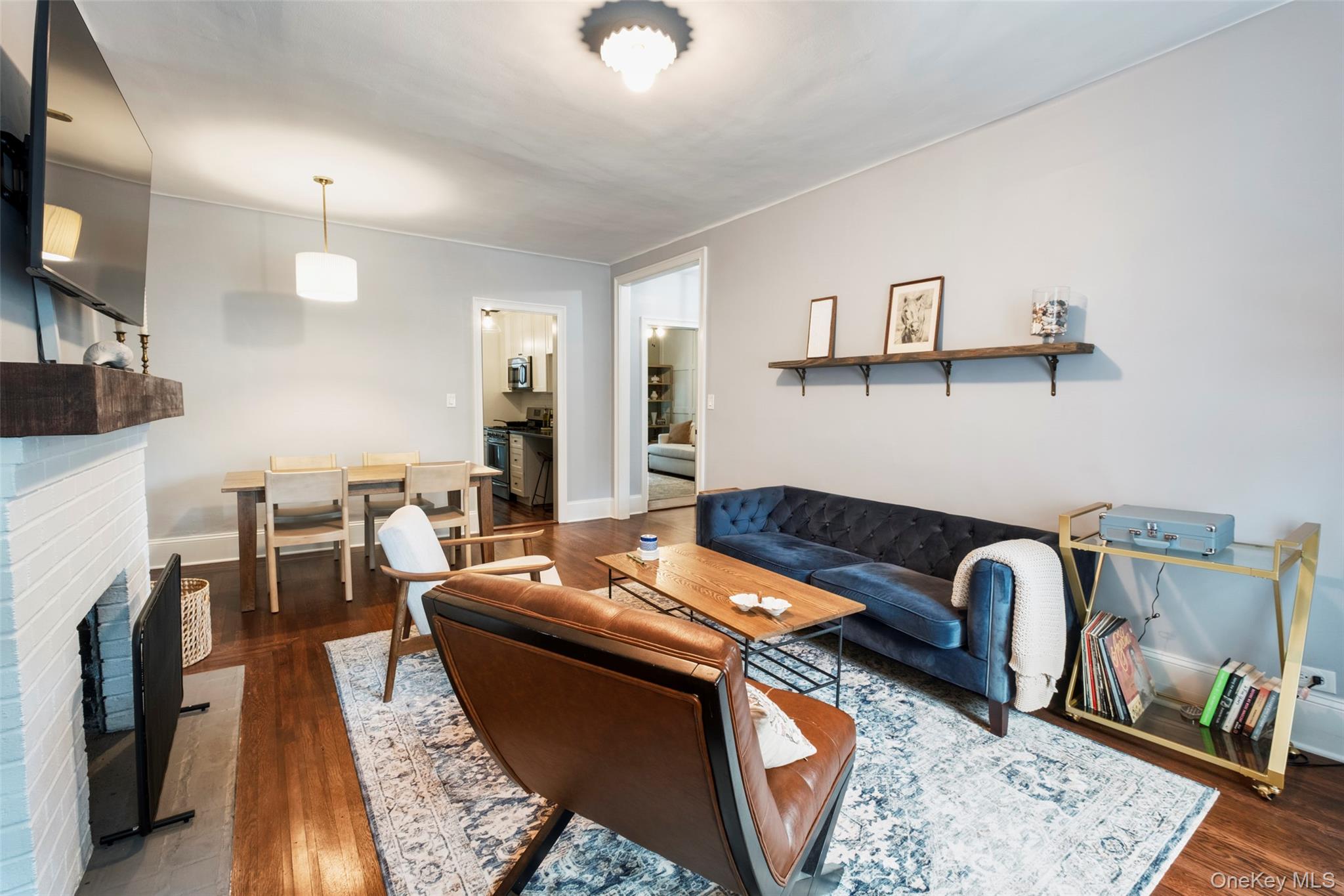 244 Bronxville Road, Unit G3 Bronxville, NY 10708 - Photo 7 of 18 a living room with furniture a rug and white walls