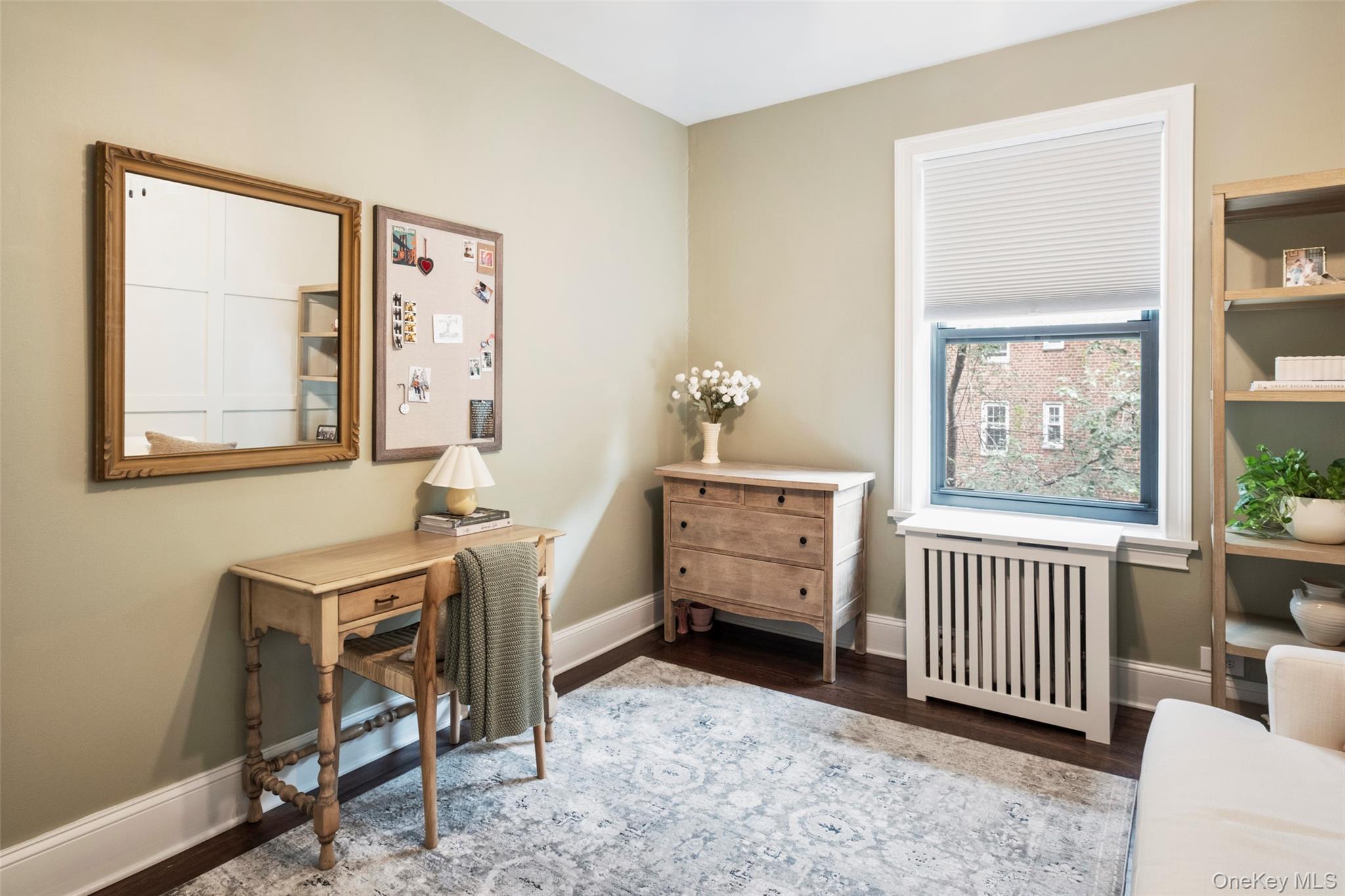 244 Bronxville Road, Unit G3 Bronxville, NY 10708 - Photo 9 of 18 a room with furniture a window and a dresser