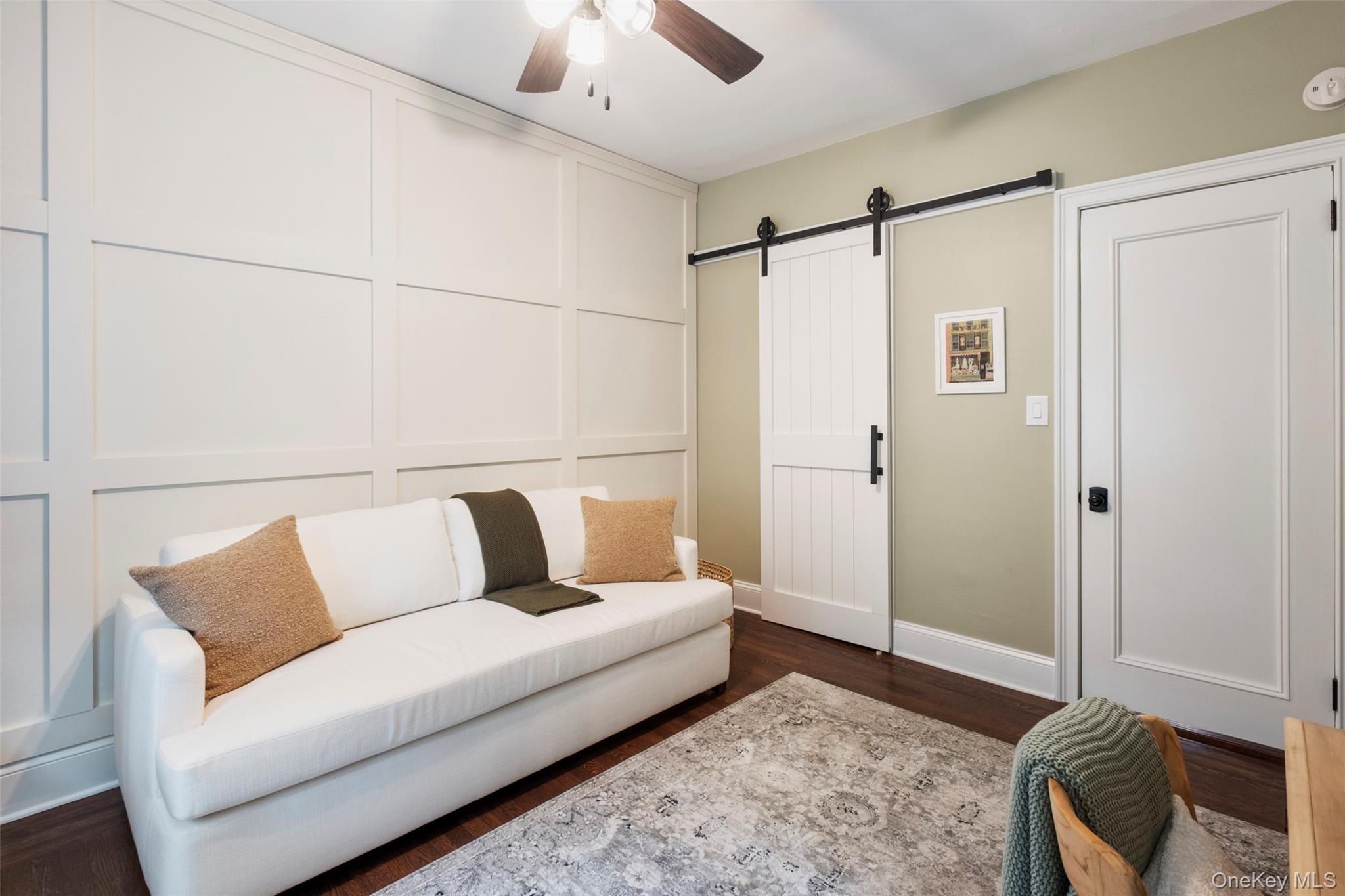 244 Bronxville Road, Unit G3 Bronxville, NY 10708 - Photo 10 of 18 a living room with furniture and a rug