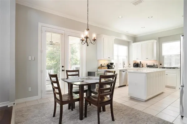 a view of a dining room with furniture and window