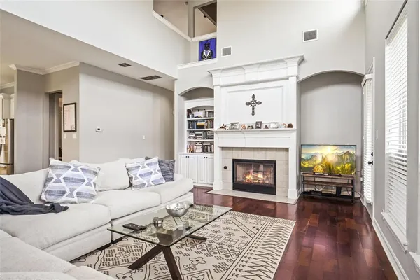 a living room with furniture and a fireplace