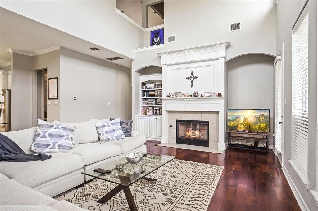 984 East Bethel School Road Coppell, TX 75019 - Photo 20 of 37 a living room with furniture and a fireplace