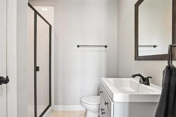 a bathroom with a sink toilet and vanity