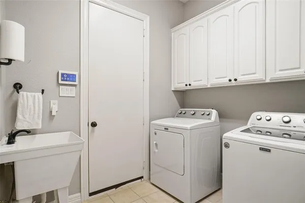 a view of storage room with washer and dryer