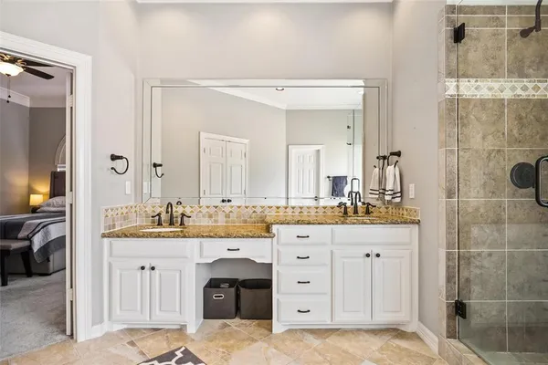 a spacious bathroom with a double vanity sink mirror and