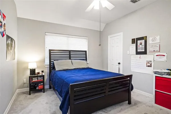 a room with a bed and a chandelier