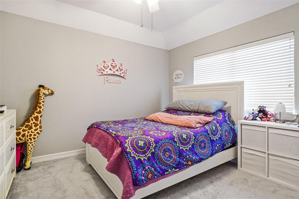 984 East Bethel School Road Coppell, TX 75019 - Photo 30 of 37 a bedroom with a bed and a window