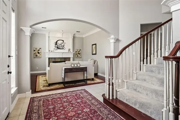 a living room with furniture and a rug