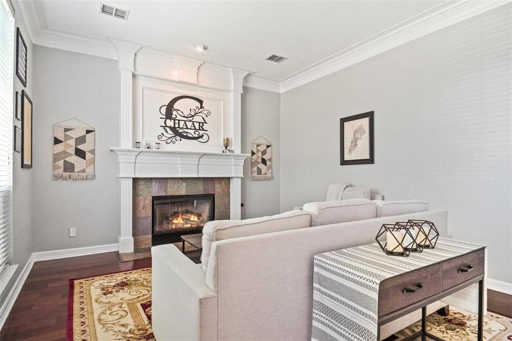 984 East Bethel School Road Coppell, TX 75019 - Photo 8 of 37 a living room with furniture and a fireplace