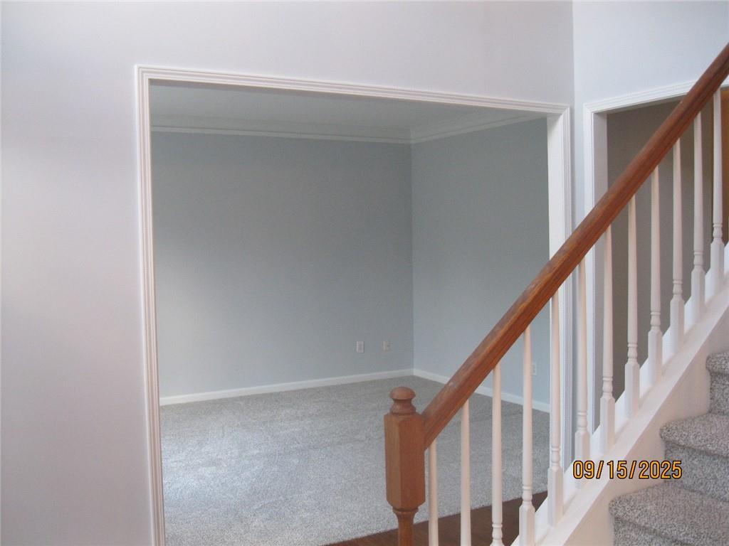 1105 Wake Robin Circle Southwest Lilburn, GA 30047 - Photo 15 of 20 a view of staircase with railing and white walls