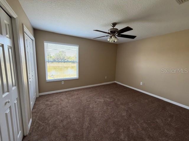 7514 Dragon Fly Loop Gibsonton, FL 33534 - Photo 7 of 11 an empty room with windows and fan