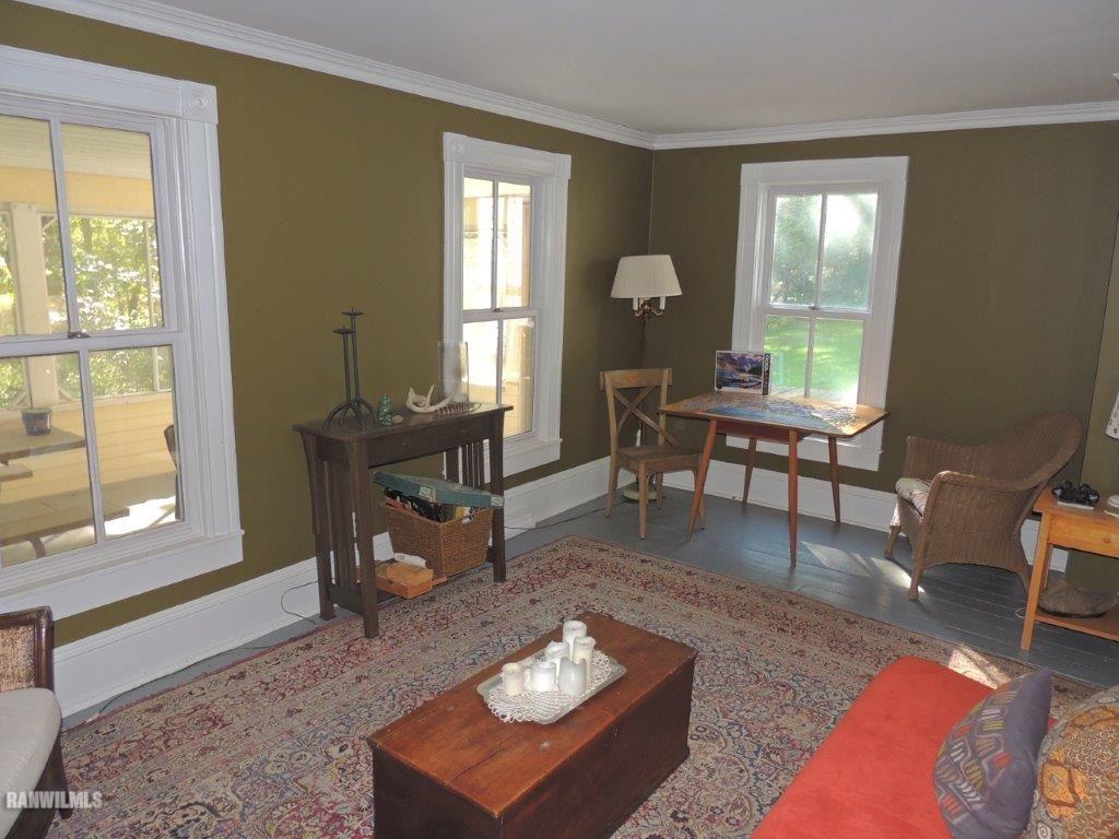 6398 South Blanding Road Hanover, IL 61041 - Photo 8 of 48 a living room with furniture a table and large windows