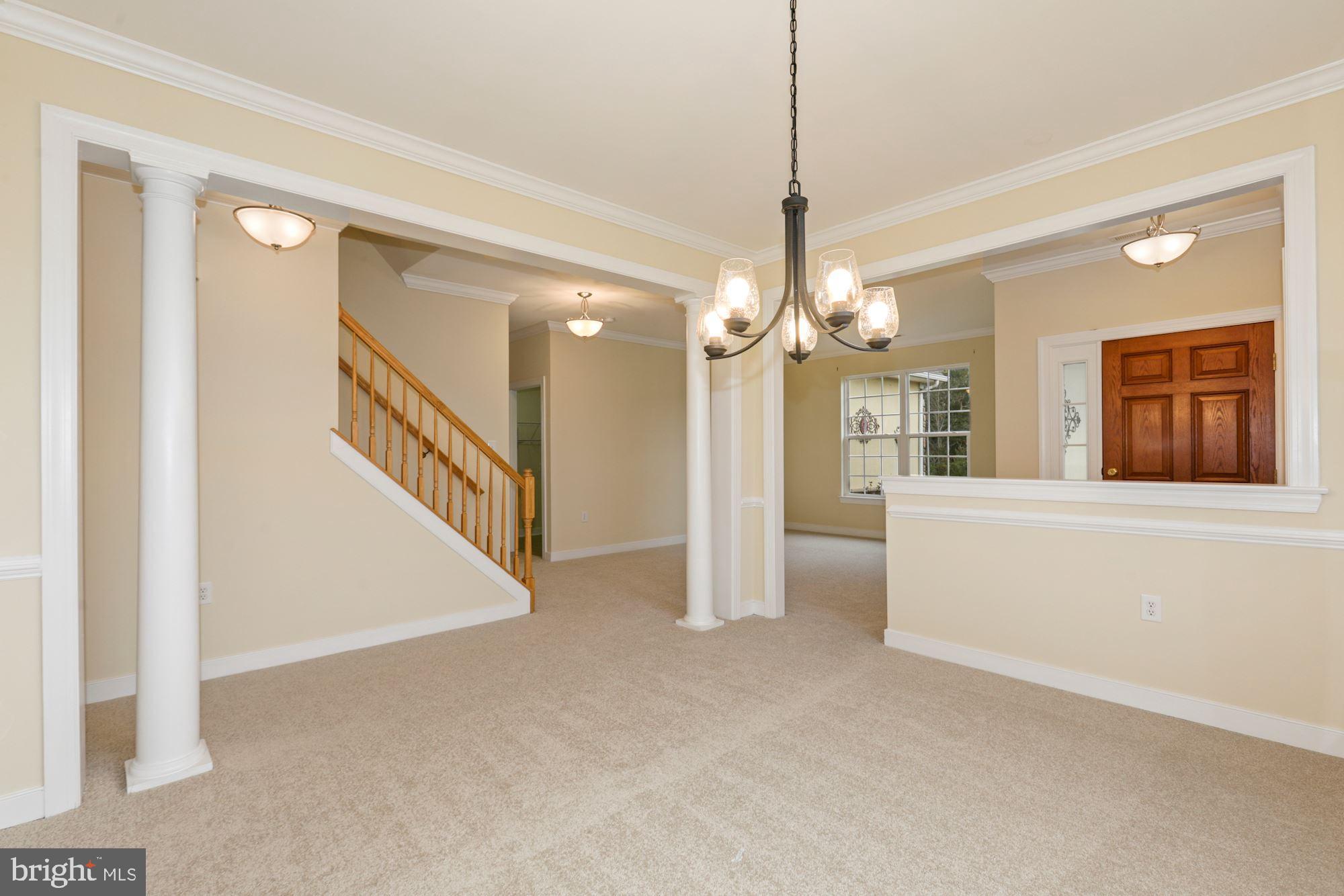 24873 Rivers Edge Road Millsboro, DE 19966 - Photo 13 of 57 Formal Dining Room with Decorative Moldings