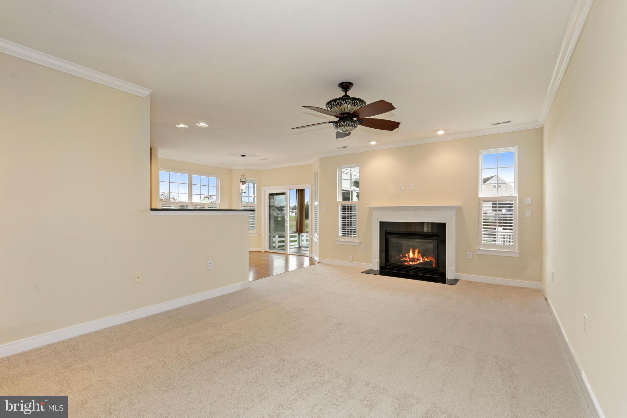 24873 Rivers Edge Road Millsboro, DE 19966 - Photo 25 of 57 Open and Airy Family Room with Gas Fireplace