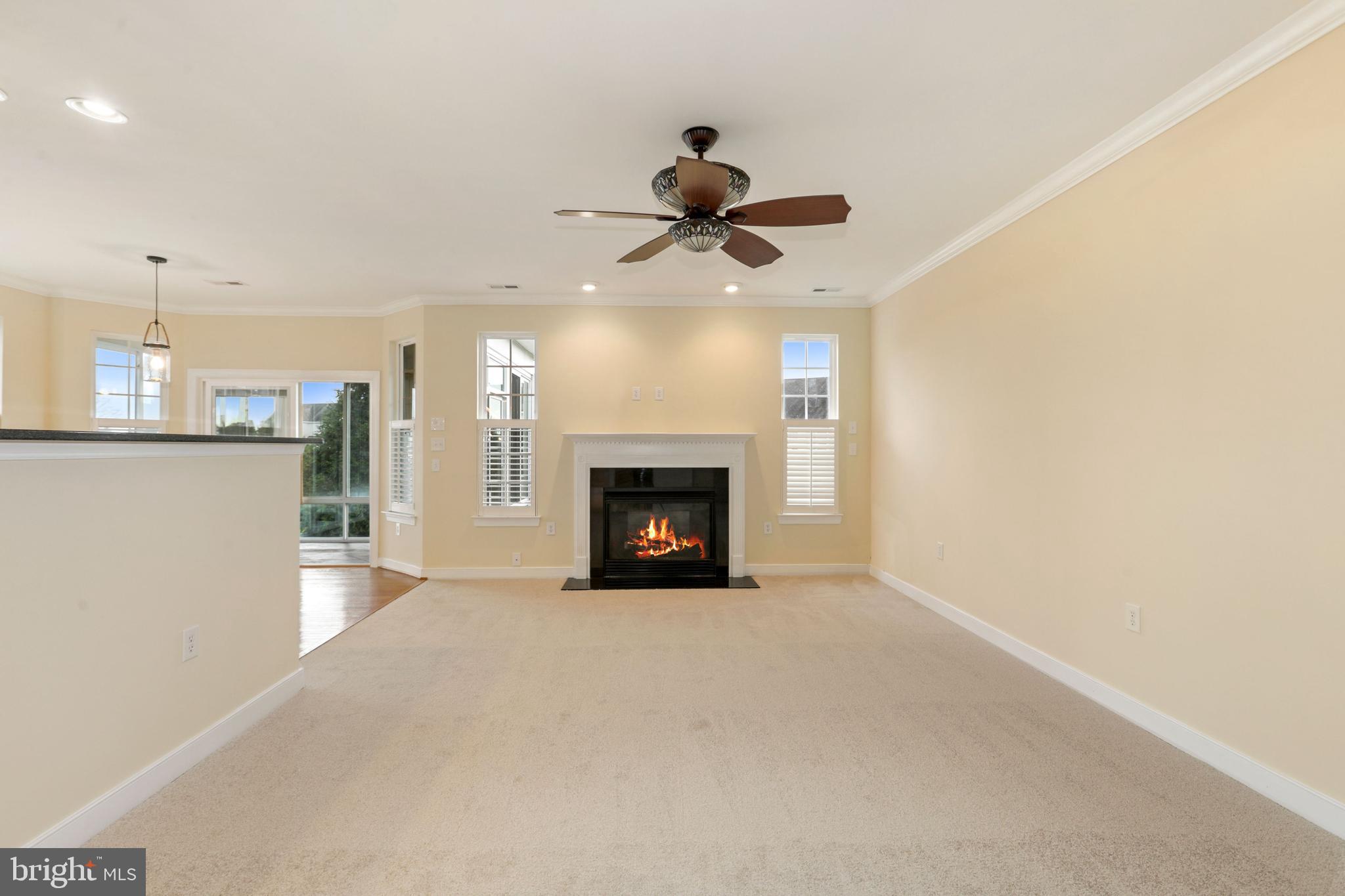 24873 Rivers Edge Road Millsboro, DE 19966 - Photo 26 of 57 Open and Airy Family Room with Gas Fireplace