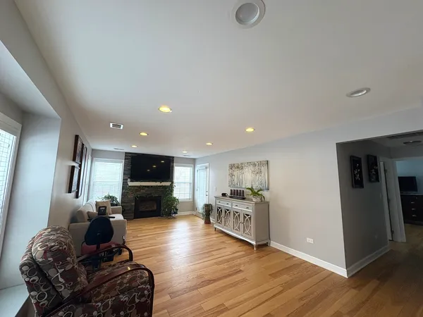 a living room with furniture and kitchen view