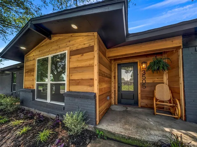 a view of front door and potted plants