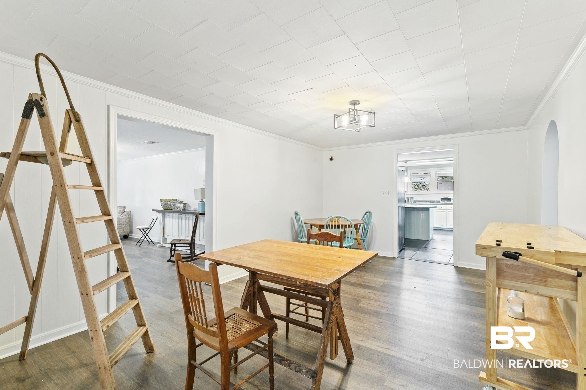 316 West Orchid Avenue Foley, AL 36535 - Photo 16 of 38 Dining space featuring wood finished floors and crown molding