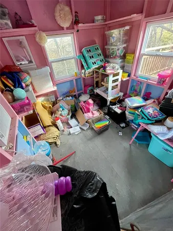 a bed sitting in a bedroom and painting on the wall