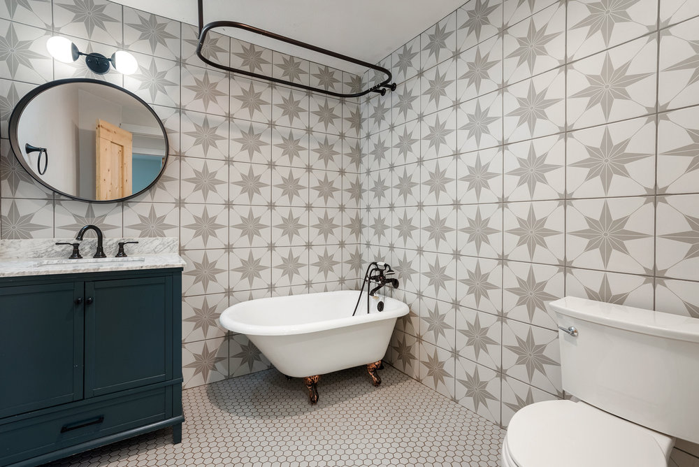 1176 Graham Street Austin, TX 78702 - Photo 10 of 20 a bathroom with a sink mirror and toilet