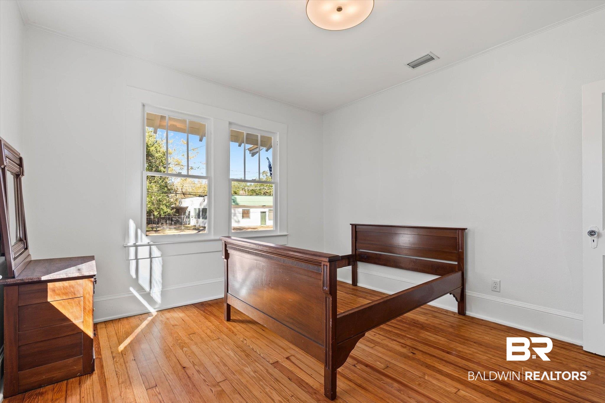 2153 Old Government Street Mobile, AL 36606 - Photo 18 of 23 Bedroom featuring light wood finished floors and baseboards