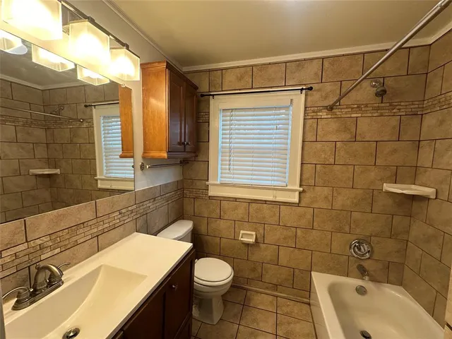 a bathroom with a sink double vanity and a mirror