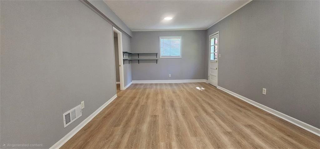1096 Deleon Court Clarkston, GA 30021 - Photo 15 of 59 a view of a room with wooden floor and window