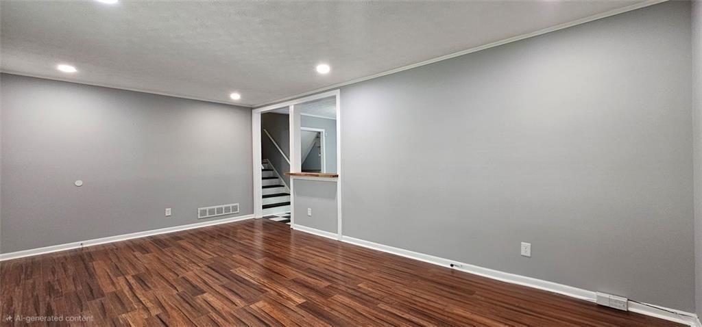 1096 Deleon Court Clarkston, GA 30021 - Photo 3 of 59 a view of an empty room with wooden floor