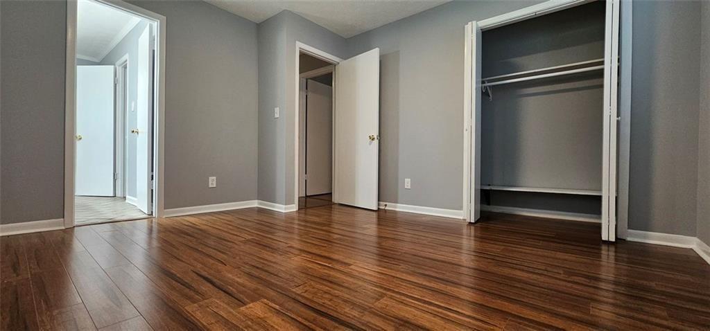 1096 Deleon Court Clarkston, GA 30021 - Photo 34 of 59 a view of empty room with wooden floor