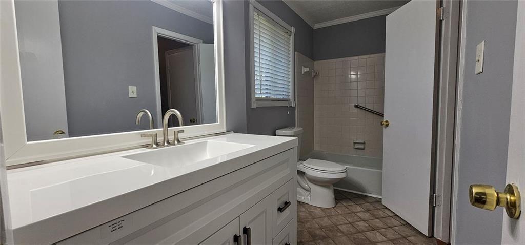 1096 Deleon Court Clarkston, GA 30021 - Photo 35 of 59 a bathroom with a double vanity sink toilet and a mirror
