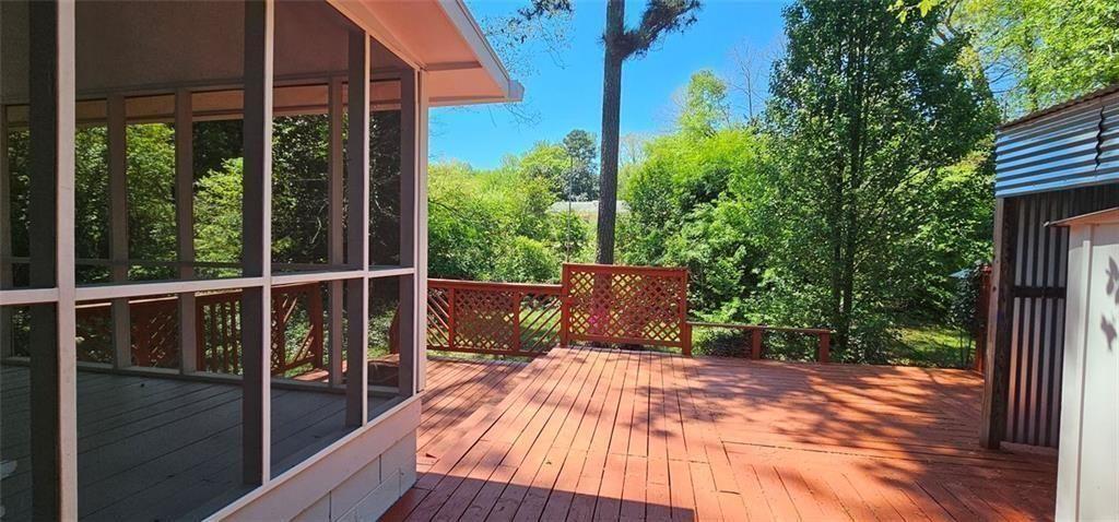 1096 Deleon Court Clarkston, GA 30021 - Photo 46 of 59 a view of balcony with wooden floor and outdoor seating
