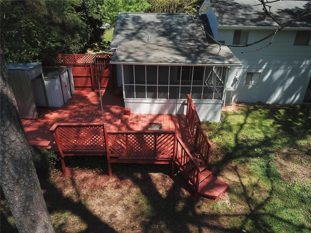 1096 Deleon Court Clarkston, GA 30021 - Photo 53 of 59 a backyard of a house with table and chairs