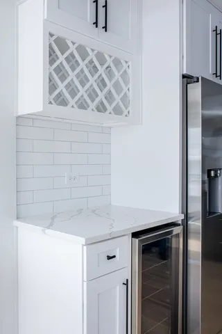 a kitchen with a sink and cabinets