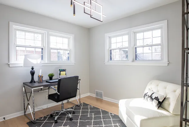 a work room with furniture and windows