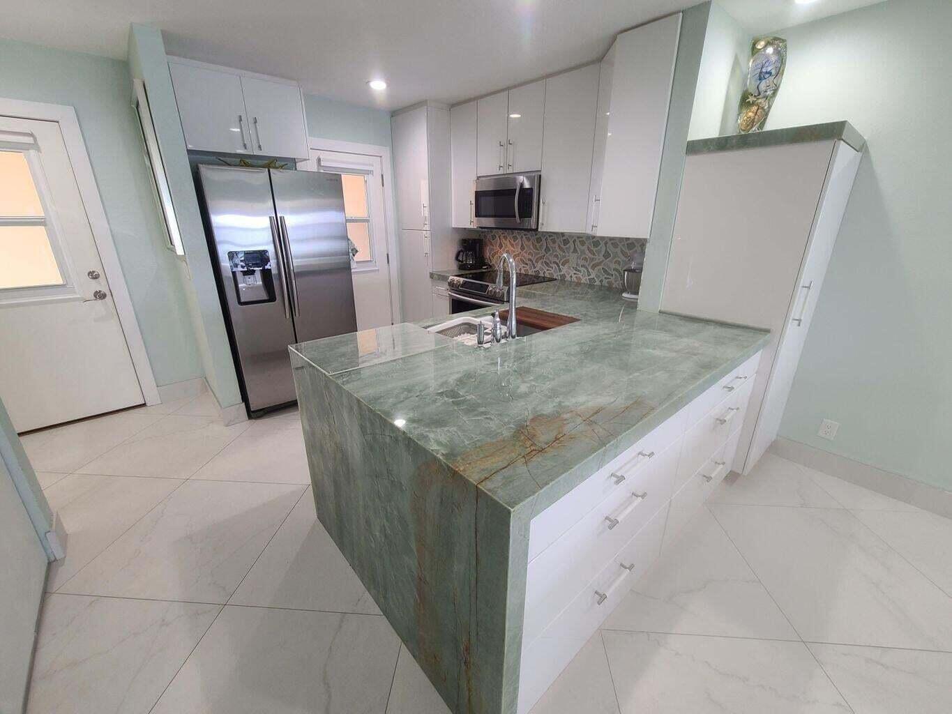 3851 North Ocean Boulevard, Unit 409 Gulf Stream, FL 33483 - Photo 4 of 29 a view of a kitchen with a sink