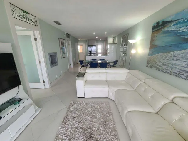 a living room with a couch and a flat screen tv