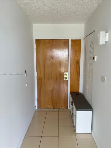 a bathroom with a shower and a sink