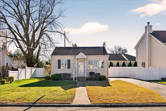 front view of a house with a yard