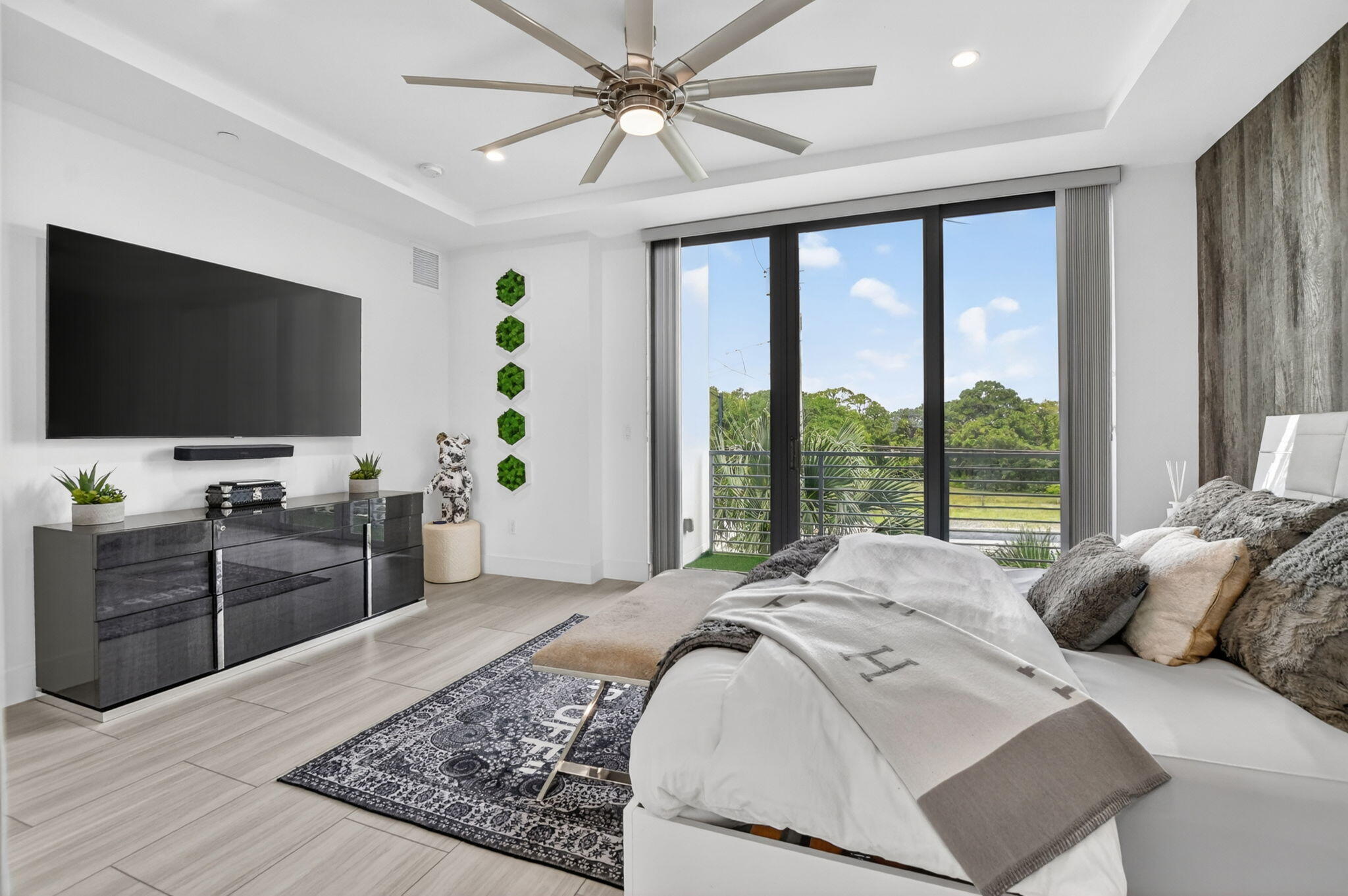 4021 Northwest 18th Way Boca Raton, FL 33431 - Photo 25 of 37 a bedroom with a bed and a flat screen tv