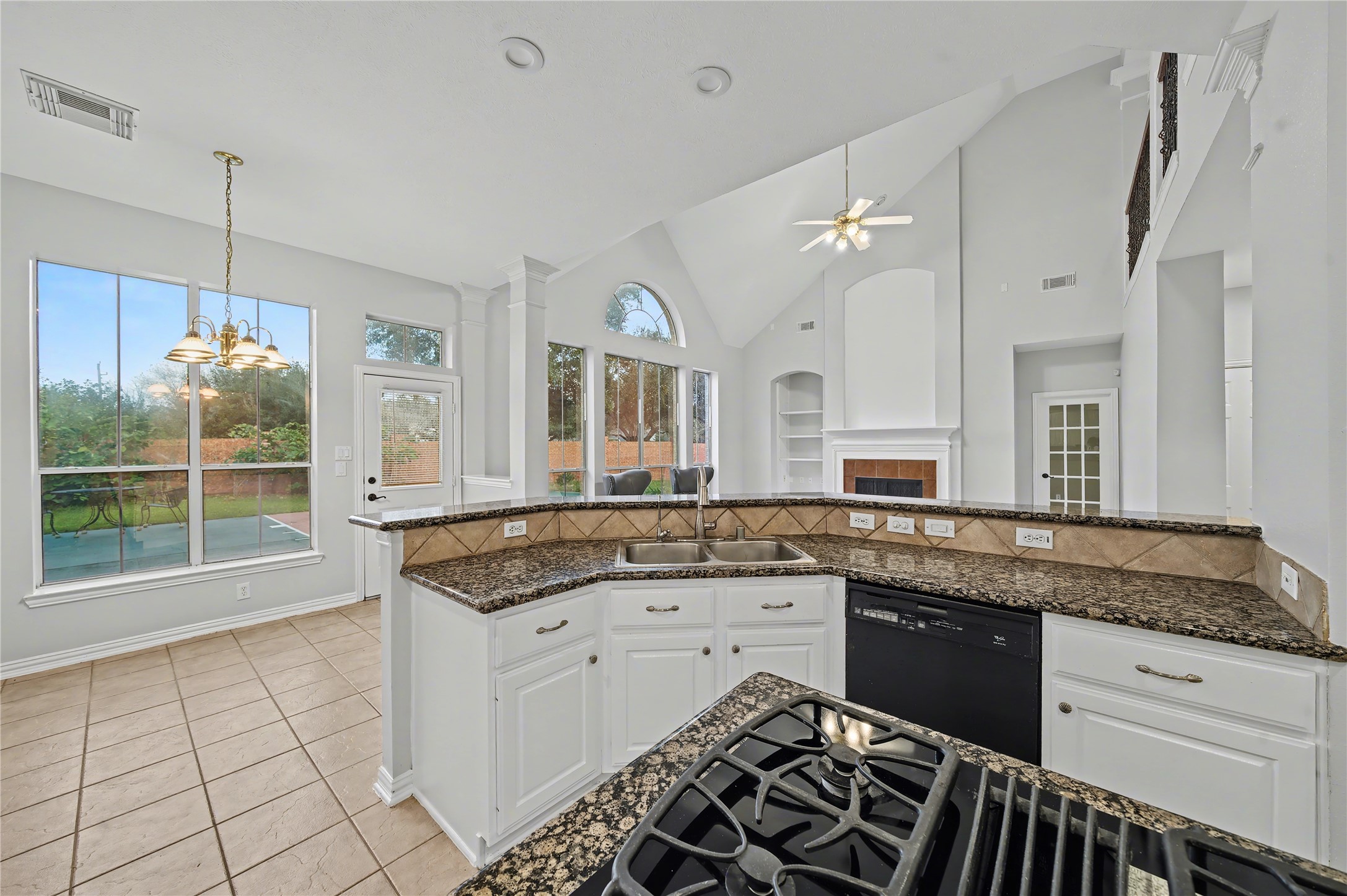 5403 Emerald Pointe Lane Sugar Land, TX 77479 - Photo 36 of 50 a large kitchen with granite countertop a stove a sink and a granite counter tops