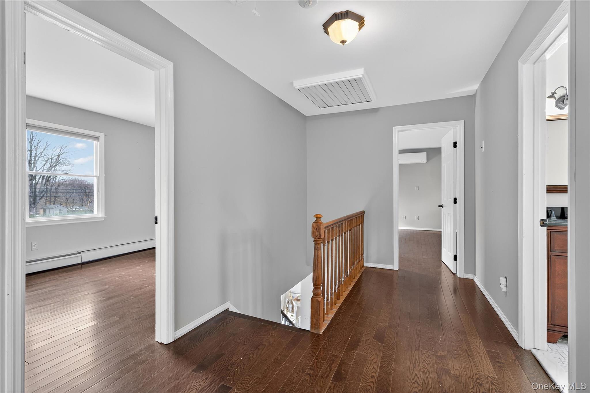 120 Pine Tree Road Monroe, NY 10950 - Photo 21 of 50 a view of a hallway with wooden floor and windows