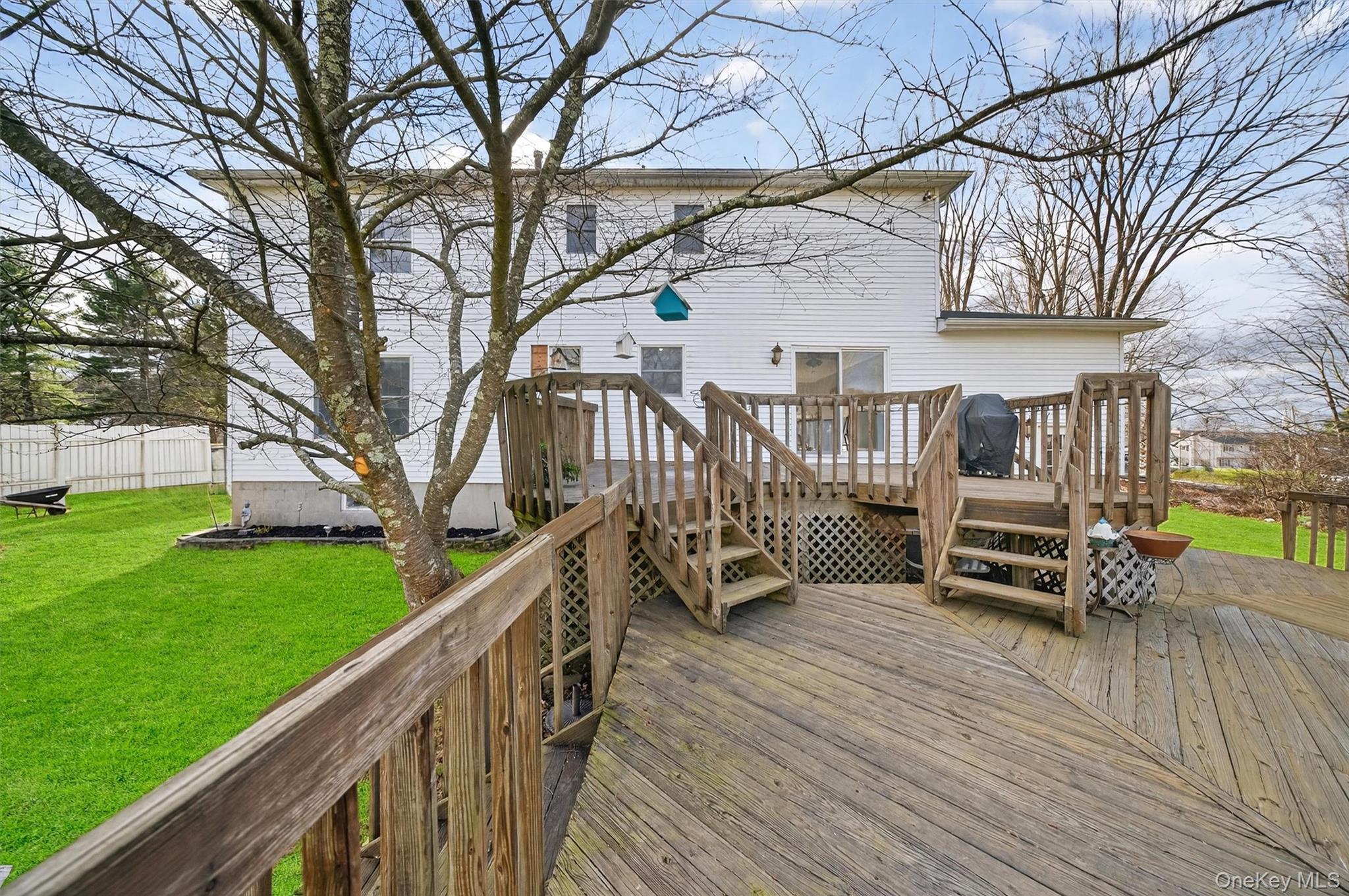 120 Pine Tree Road Monroe, NY 10950 - Photo 36 of 50 a view of a deck with two couches next to a yard