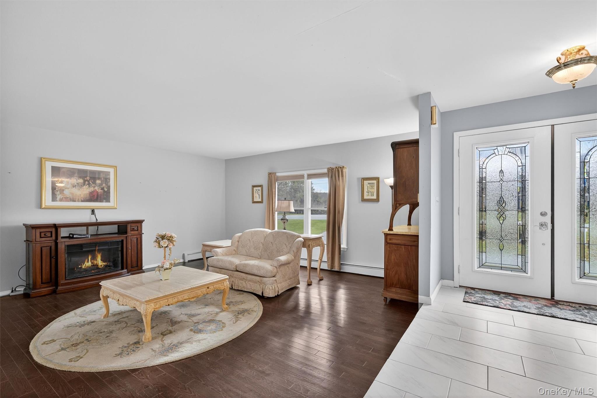 120 Pine Tree Road Monroe, NY 10950 - Photo 8 of 50 a living room with furniture and a fireplace