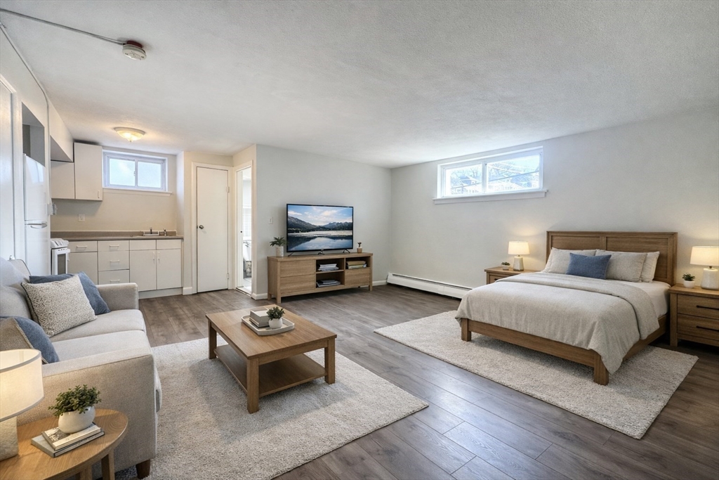 16 Vinal Street, Unit B2 Boston, MA 02135 - Photo 1 of 13 a bedroom with a bed and a couch