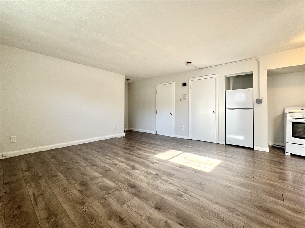 16 Vinal Street, Unit B2 Boston, MA 02135 - Photo 4 of 13 a view of a livingroom with wooden floor