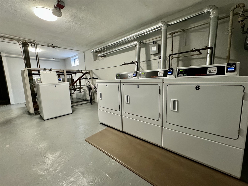 16 Vinal Street, Unit B2 Boston, MA 02135 - Photo 8 of 13 a utility room with dryer and washer