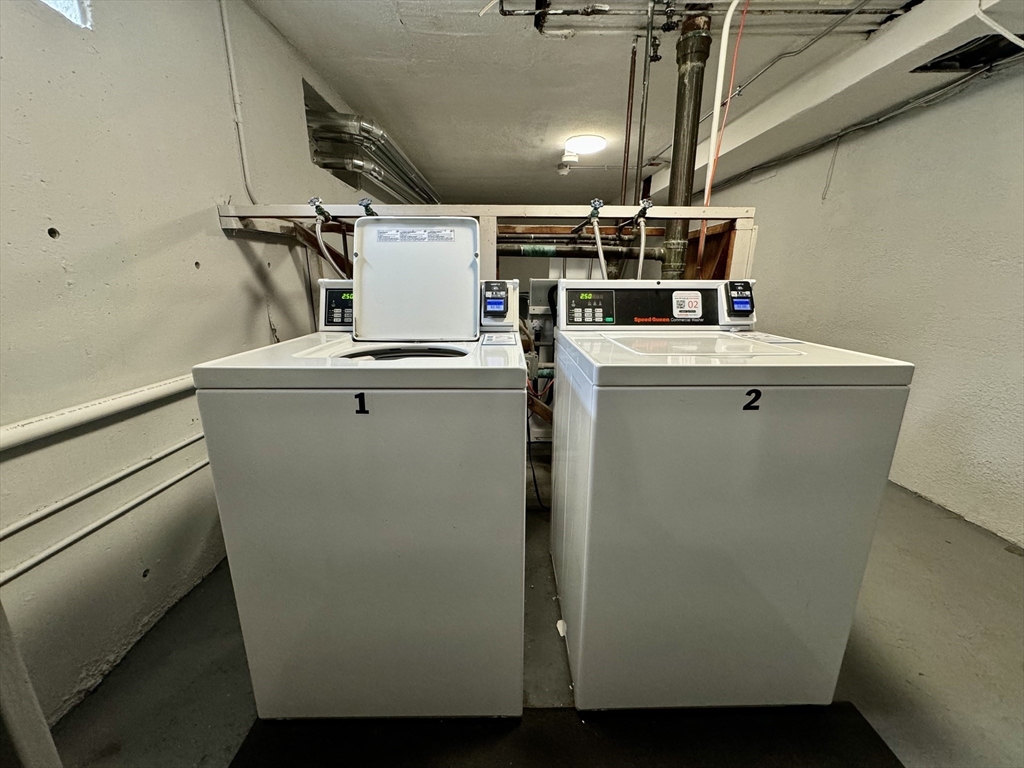 16 Vinal Street, Unit B2 Boston, MA 02135 - Photo 9 of 13 a view of storage and utility room with washer and dryer