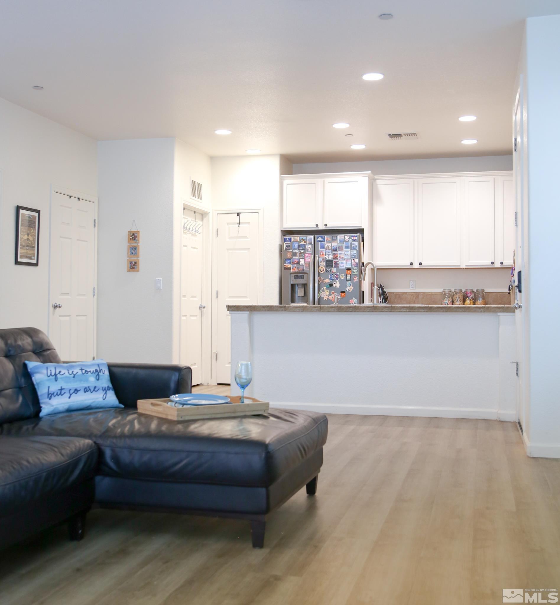 1872 Wind Ranch Road, Unit A Reno, NV 89521 - Photo 11 of 33 a living room with kitchen and furniture