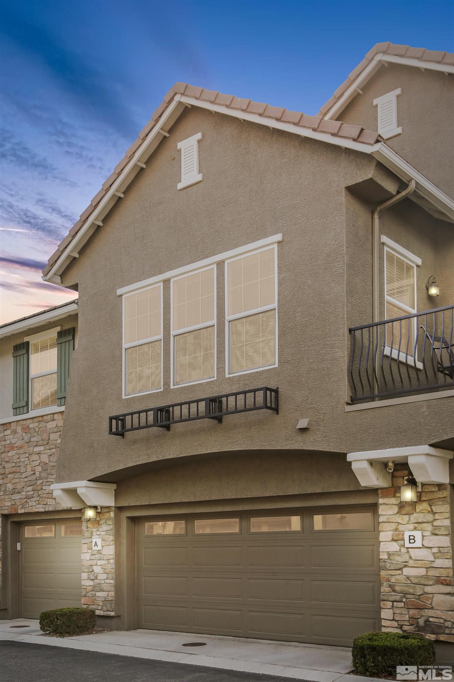 1872 Wind Ranch Road, Unit A Reno, NV 89521 - Photo 2 of 33 a front view of a house with parking
